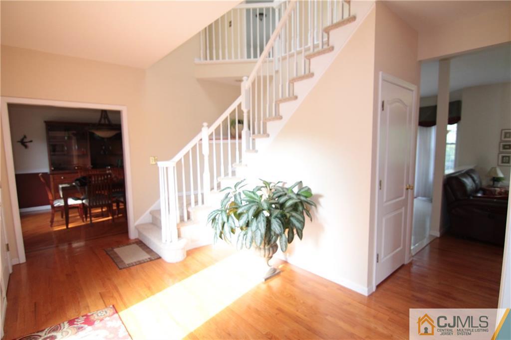 15 Gramercy Road Monmouth Junction, NJ 08852 - Photo 14 of 17 a view of entryway and hall with wooden floor