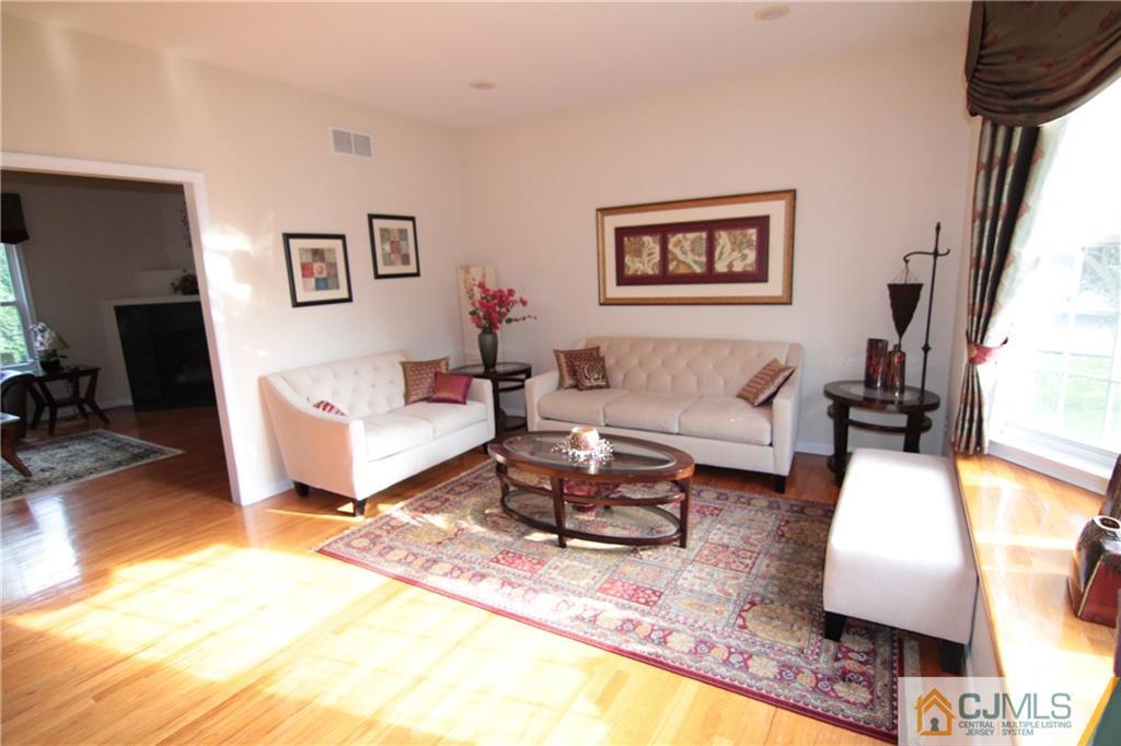 15 Gramercy Road Monmouth Junction, NJ 08852 - Photo 5 of 17 a living room with furniture and a rug