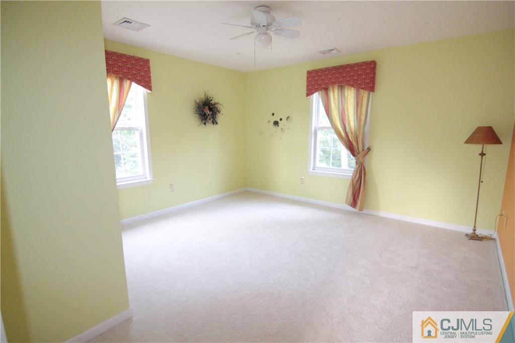 15 Gramercy Road Monmouth Junction, NJ 08852 - Photo 7 of 17 an empty room with windows and closet