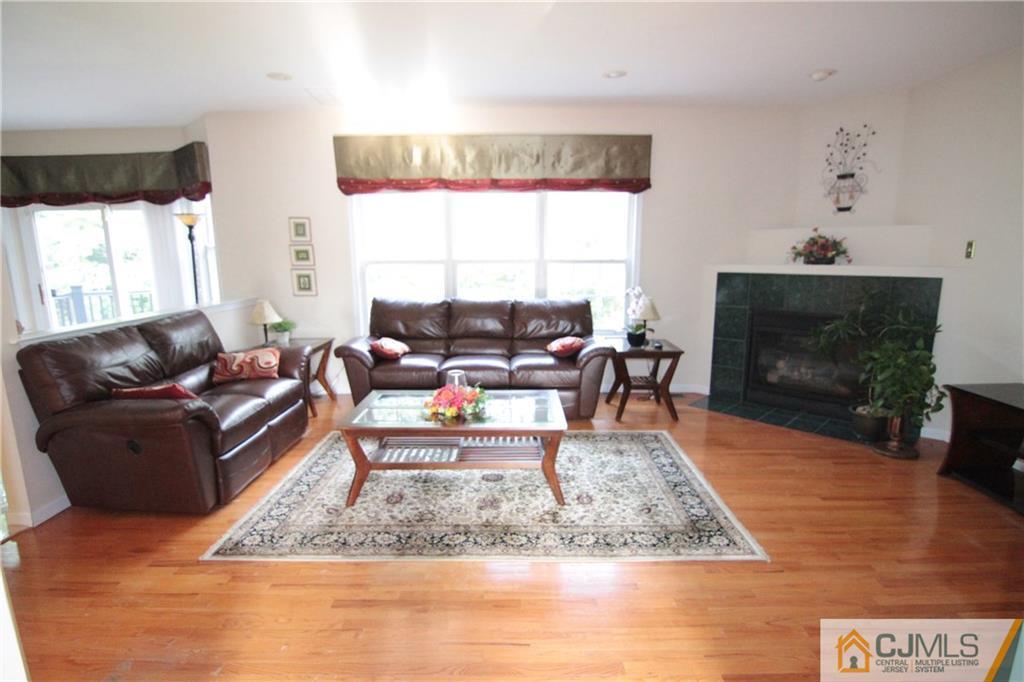 15 Gramercy Road Monmouth Junction, NJ 08852 - Photo 8 of 17 a living room with furniture and a fireplace