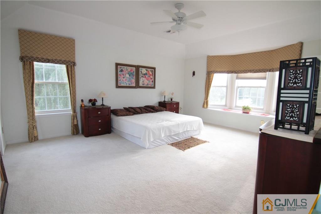 15 Gramercy Road Monmouth Junction, NJ 08852 - Photo 9 of 17 a bed room with a bed and a tv