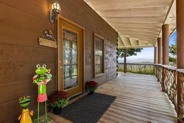 a balcony with furniture and wooden floor