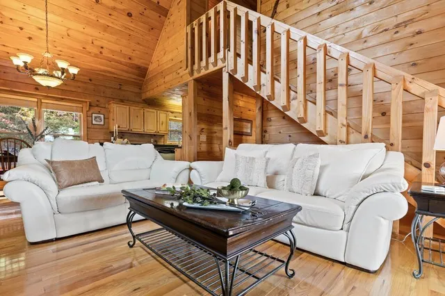 a view of living room with furniture and a fireplace