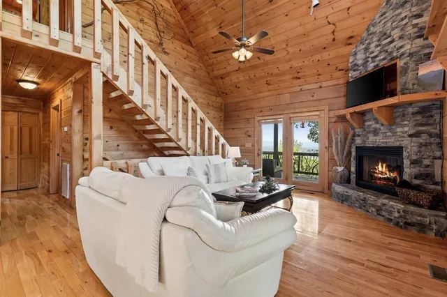 a living room with furniture fireplace and a fireplace