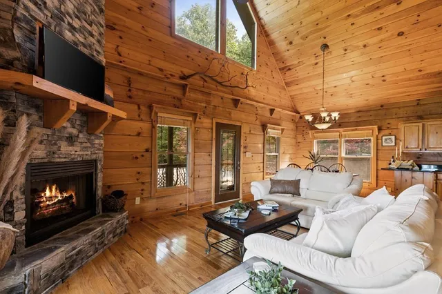 a kitchen with granite countertop a refrigerator stove and sink