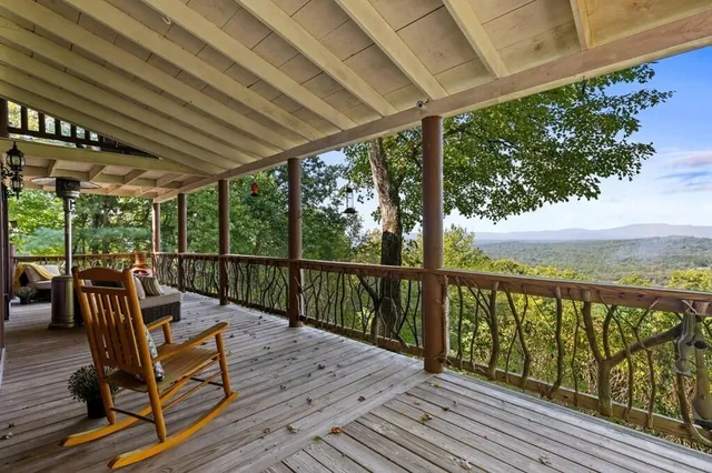 a view of a two chairs in the balcony