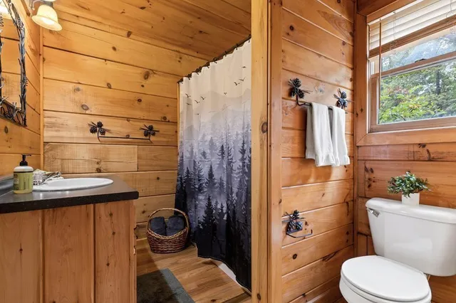 a view of balcony with wooden floor and fence