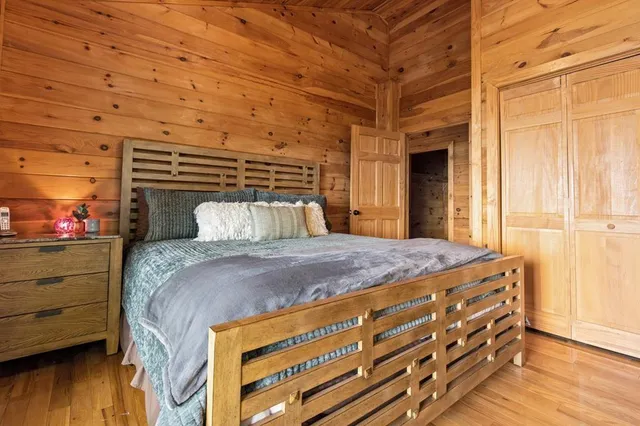 a balcony with furniture and wooden floor