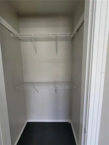 a view of a room with racks on the wall