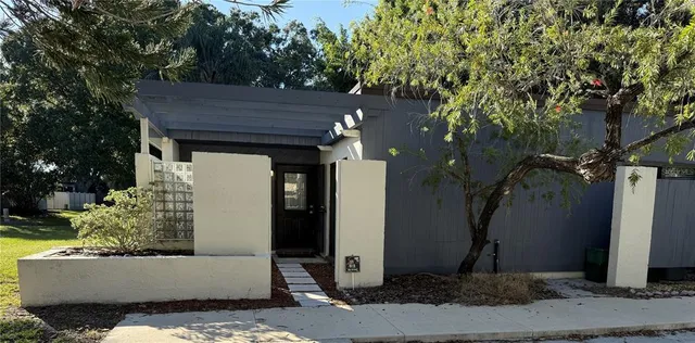 a view of house with backyard