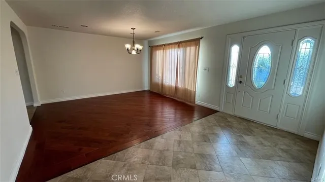wooden floor in an empty room with a mirror