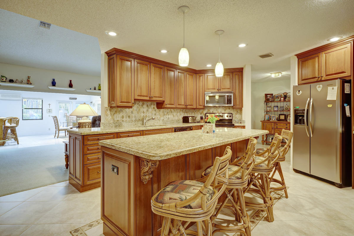 23365 Water Circle Boca Raton, FL 33486 - Photo 14 of 44 Granite Kitchen with Island seating