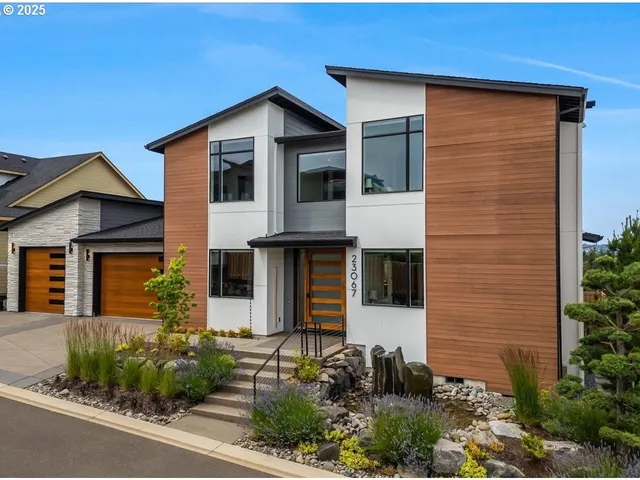 a front view of a house with garden