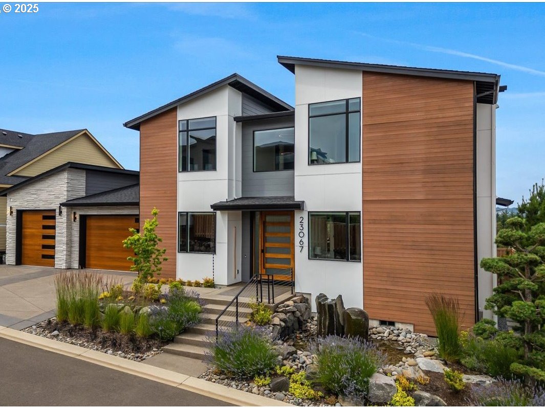a front view of a house with garden