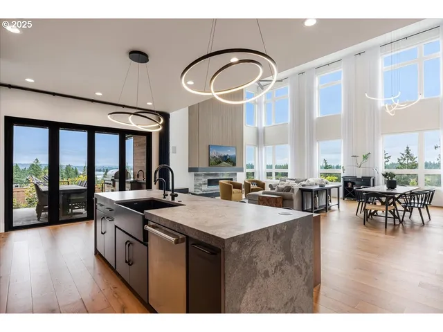 a open kitchen with stainless steel appliances granite countertop a stove and cabinets