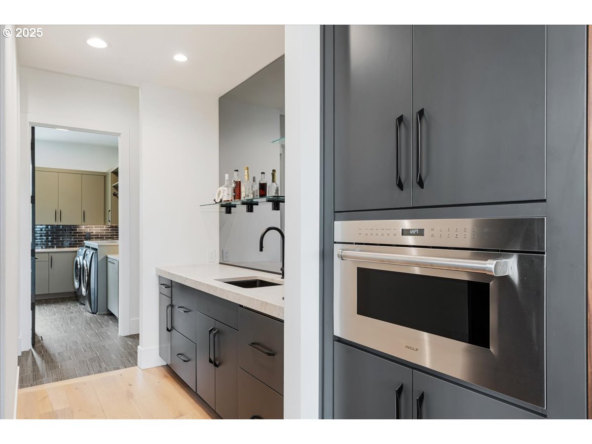 23067 Southwest Curry Ridge Drive Sherwood, OR 97140 - Photo 15 of 48 a bathroom with a sink and a mirror