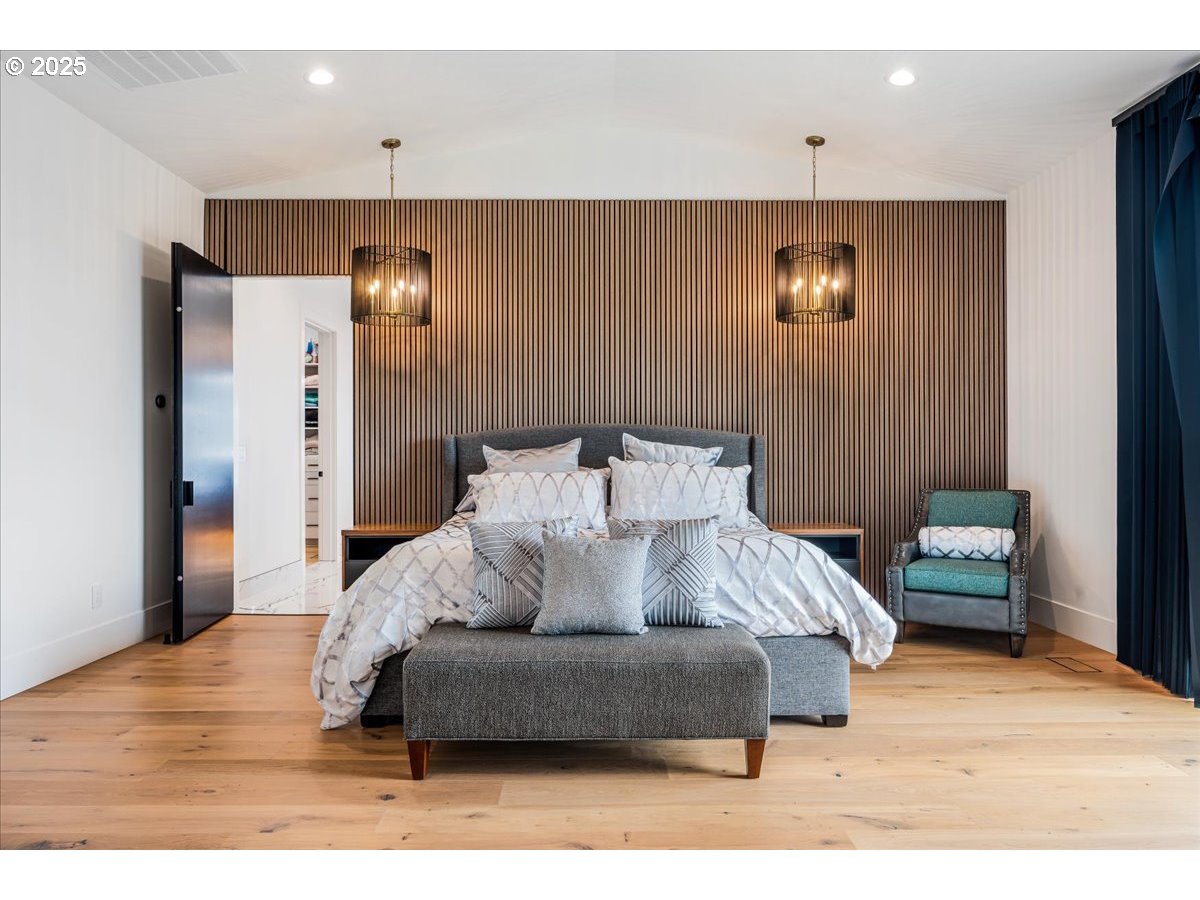 23067 Southwest Curry Ridge Drive Sherwood, OR 97140 - Photo 16 of 48 a living room with furniture and a lamp