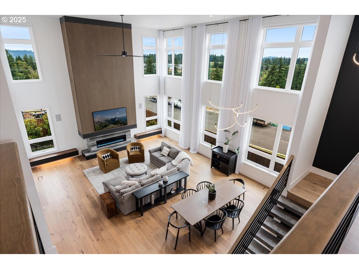 23067 Southwest Curry Ridge Drive Sherwood, OR 97140 - Photo 22 of 48 a living room with furniture and a flat screen tv
