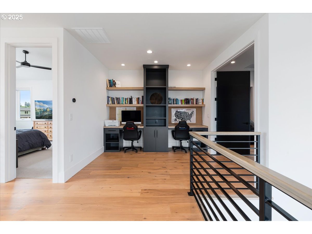 23067 Southwest Curry Ridge Drive Sherwood, OR 97140 - Photo 28 of 48 a living room with stainless steel appliances furniture a kitchen view and a fireplace