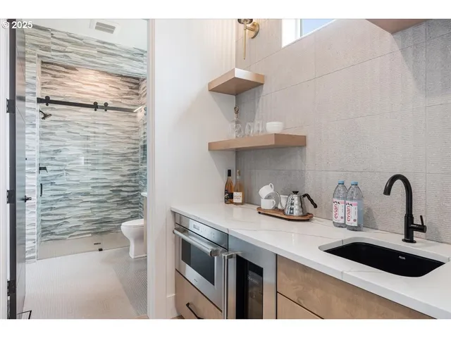 a kitchen with a sink and cabinets