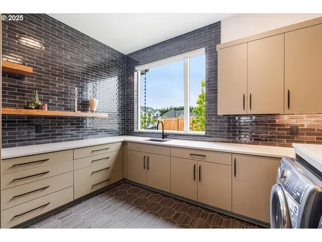 a kitchen with sink and window