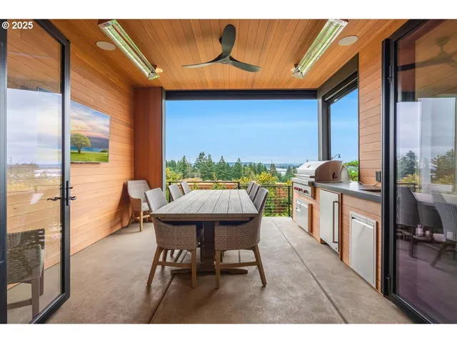 a view of a patio with table and chairs