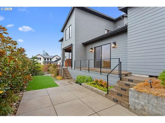 a front view of a house with garden