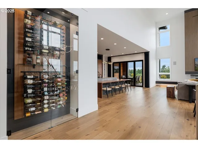 a view of livingroom with dining room and chandelier