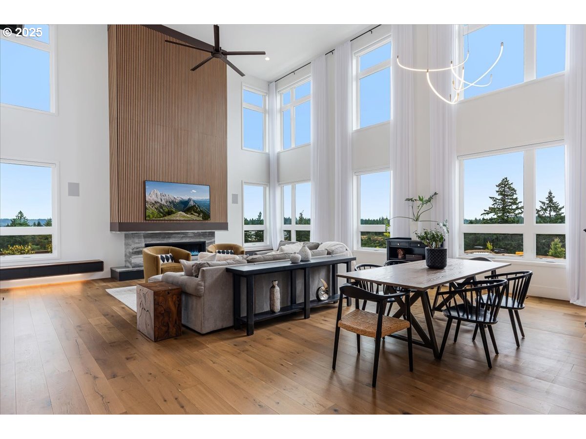 23067 Southwest Curry Ridge Drive Sherwood, OR 97140 - Photo 8 of 48 a view of a dining room with furniture window and wooden floor