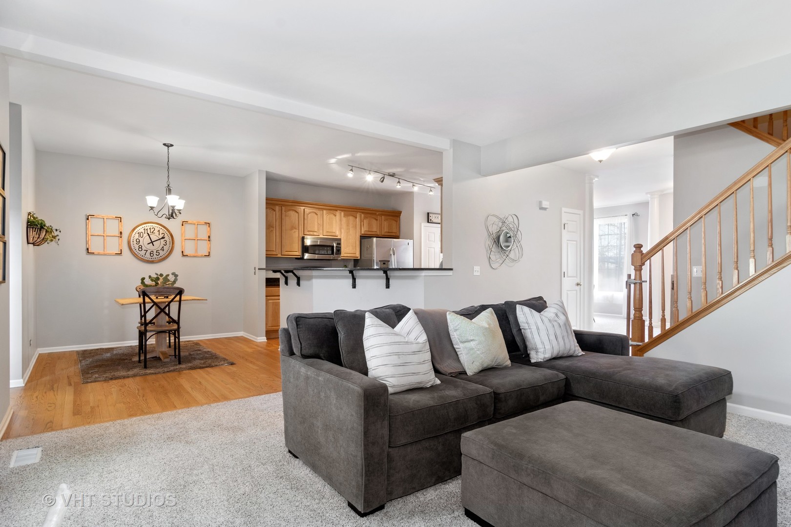 1931 Wagner Road Batavia, IL 60510 - Photo 13 of 27 a living room with furniture kitchen view and a chandelier