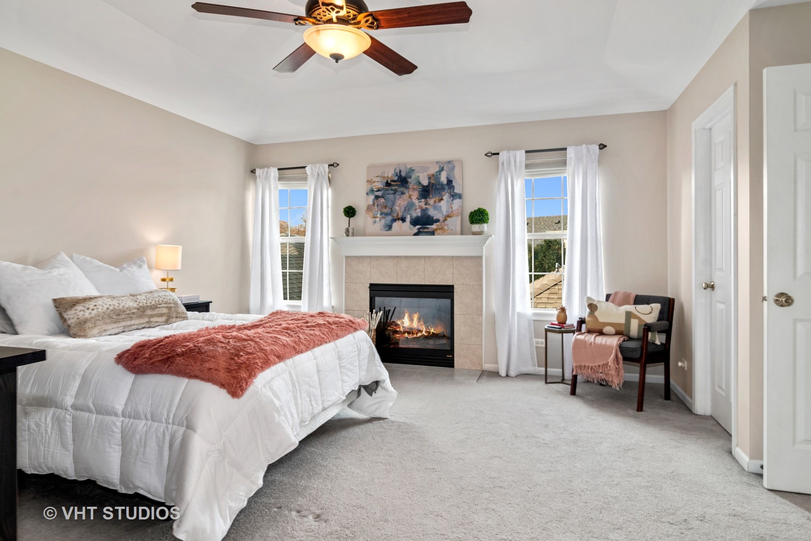 1931 Wagner Road Batavia, IL 60510 - Photo 16 of 27 a spacious bedroom with a bed and a fireplace