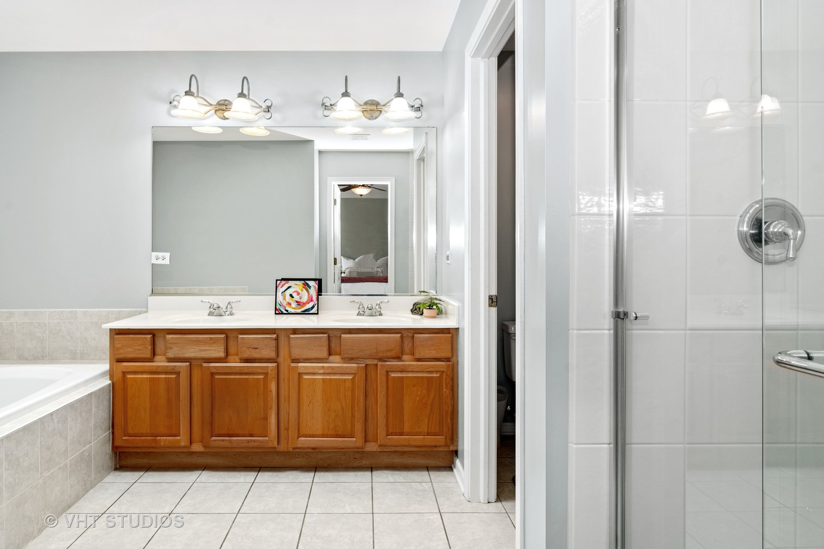 1931 Wagner Road Batavia, IL 60510 - Photo 17 of 27 a bathroom with a sink vanity and mirror