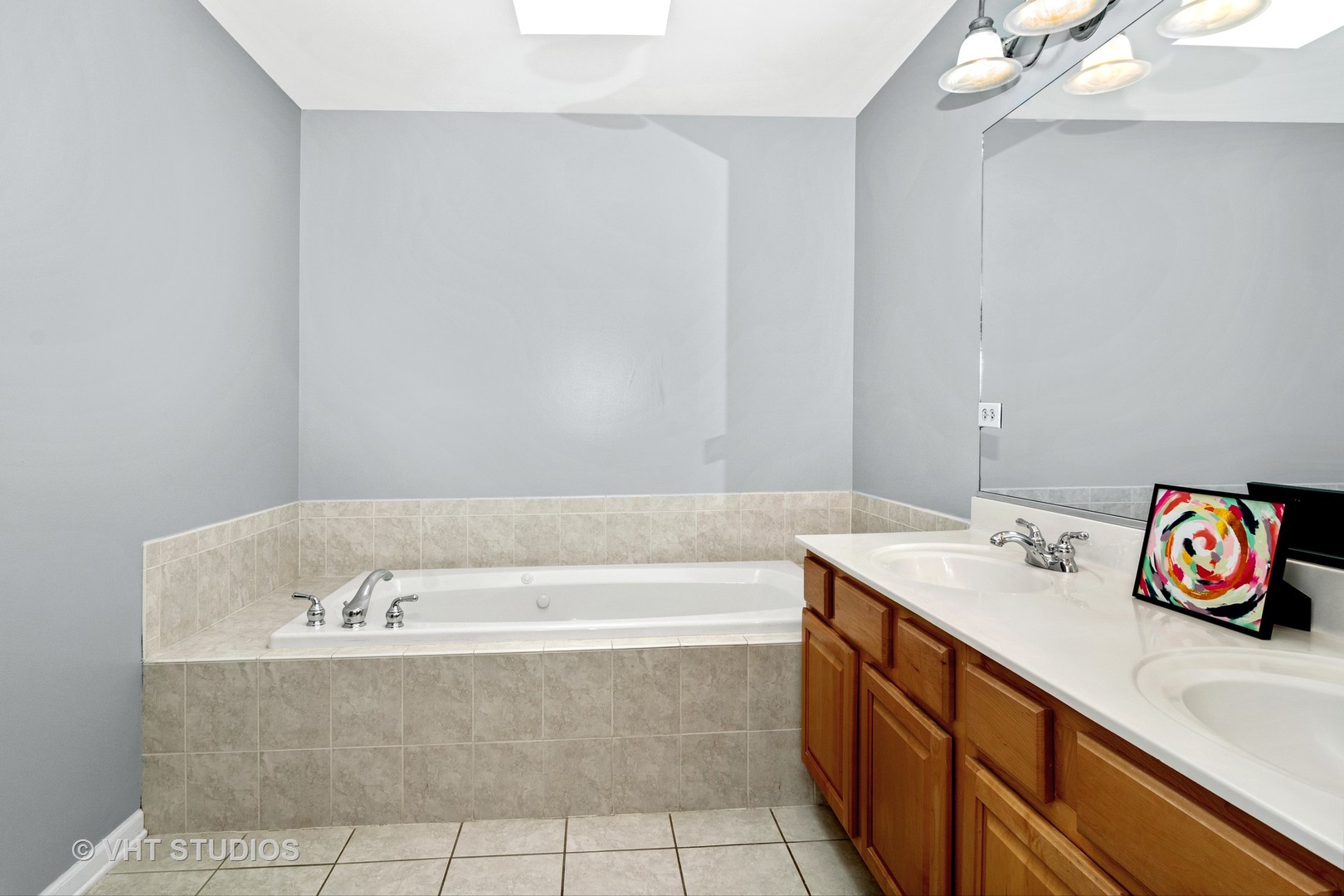 1931 Wagner Road Batavia, IL 60510 - Photo 18 of 27 a bathroom with a bathtub sink and vanity