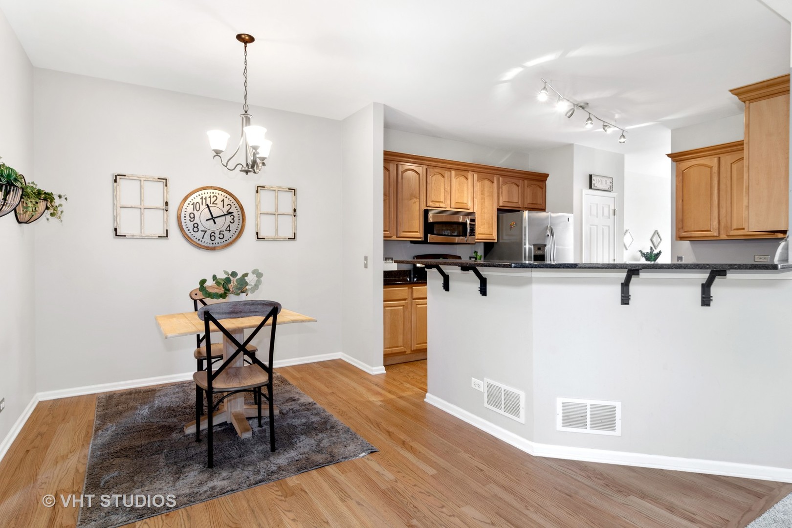 1931 Wagner Road Batavia, IL 60510 - Photo 27 of 27 a view of a kitchen area with furniture and wooden floor