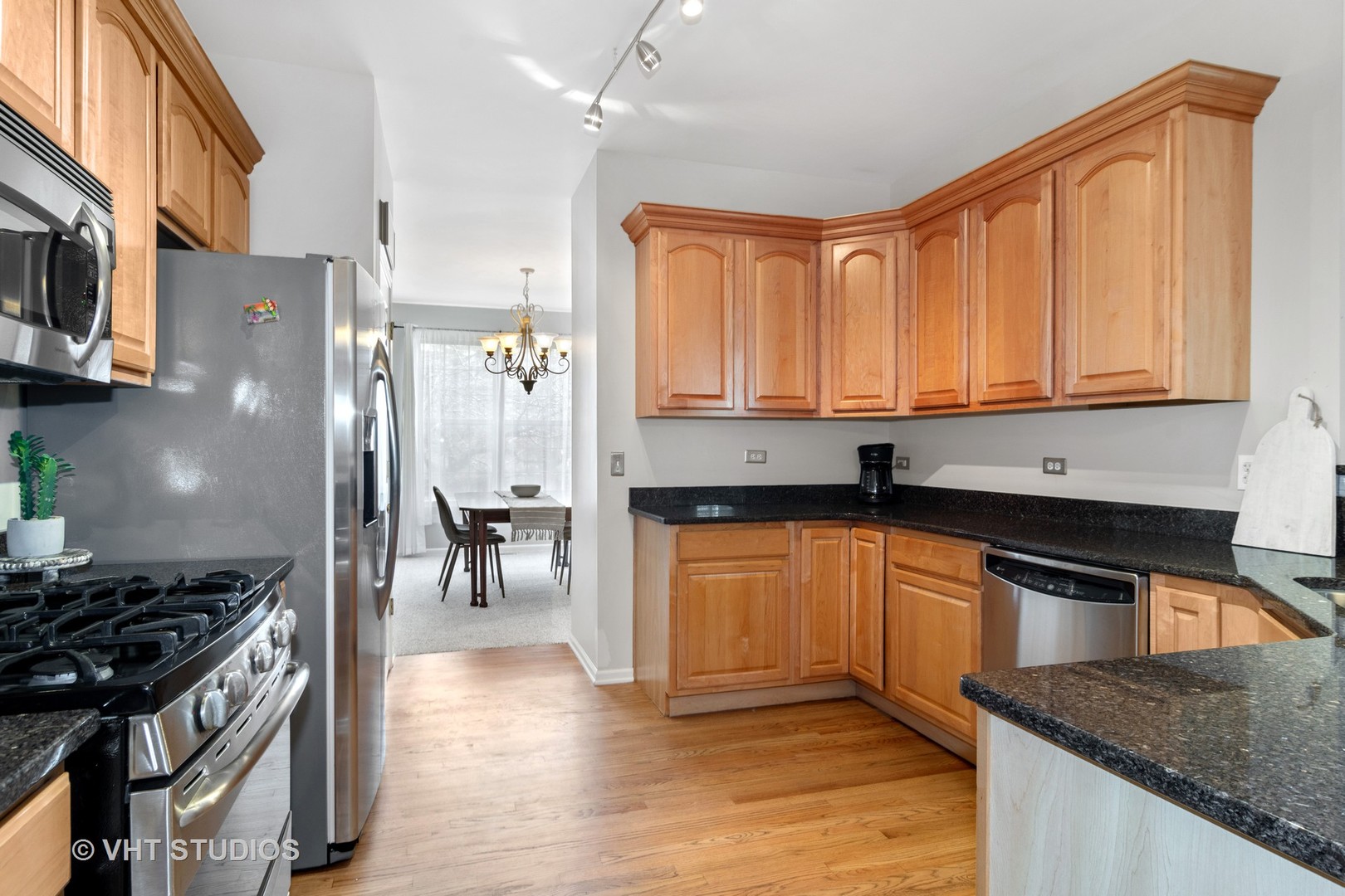1931 Wagner Road Batavia, IL 60510 - Photo 7 of 27 a kitchen with stainless steel appliances granite countertop a stove a sink and a refrigerator