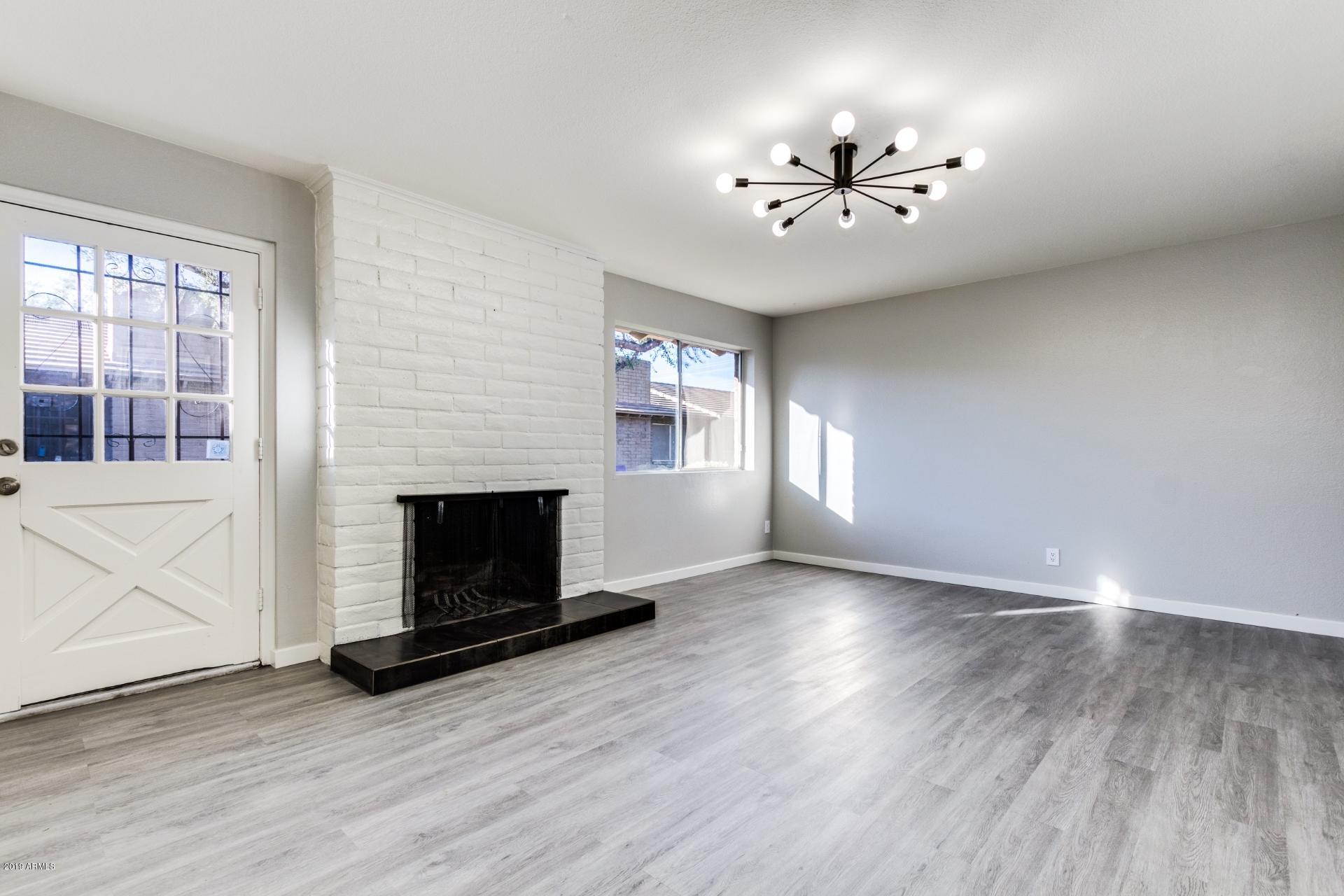 2725 South Rural Road, Unit 2 Tempe, AZ 85282 - Photo 1 of 17 Living room with stylish light fixture