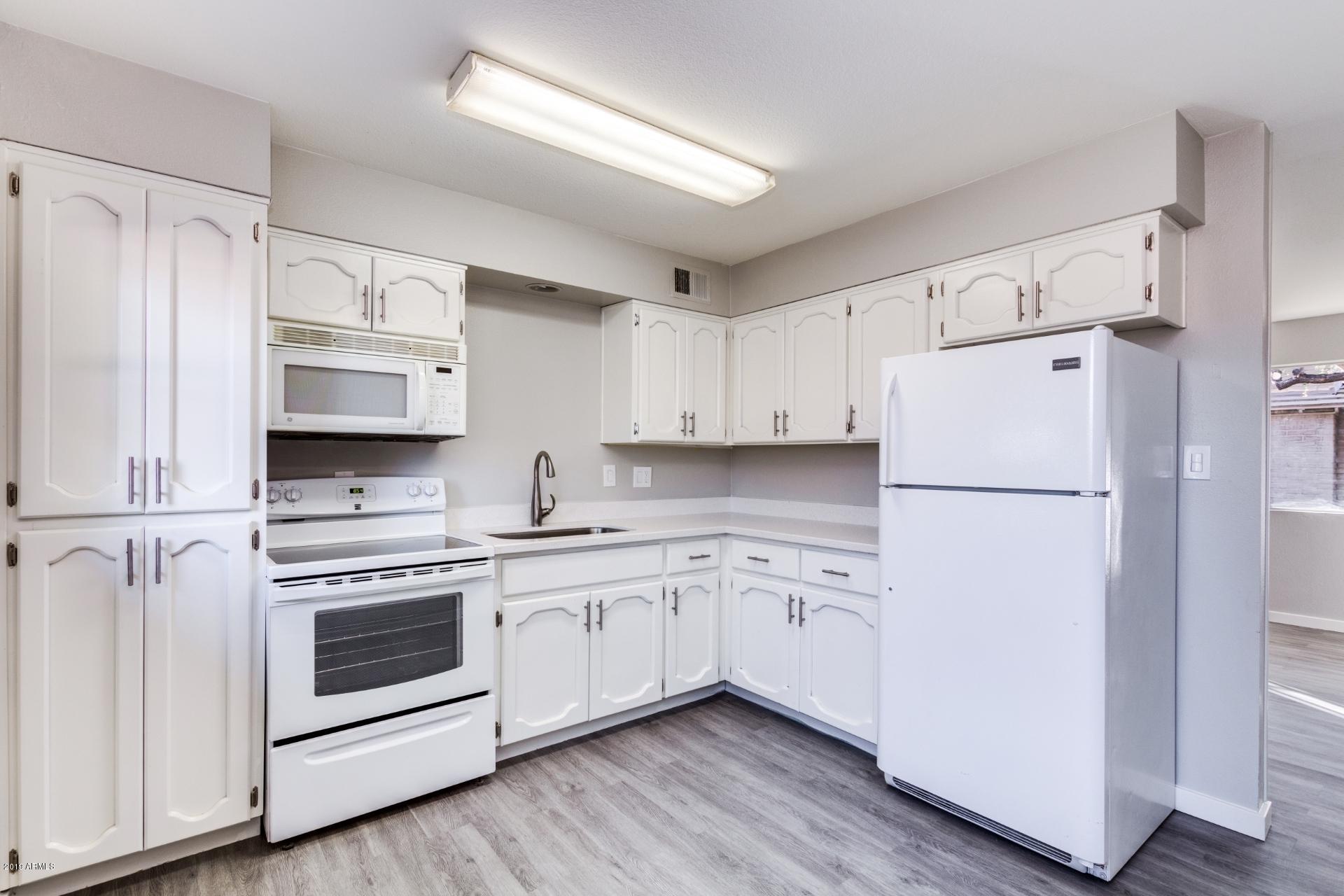 2725 South Rural Road, Unit 2 Tempe, AZ 85282 - Photo 2 of 17 Bright kitchen with granite counters