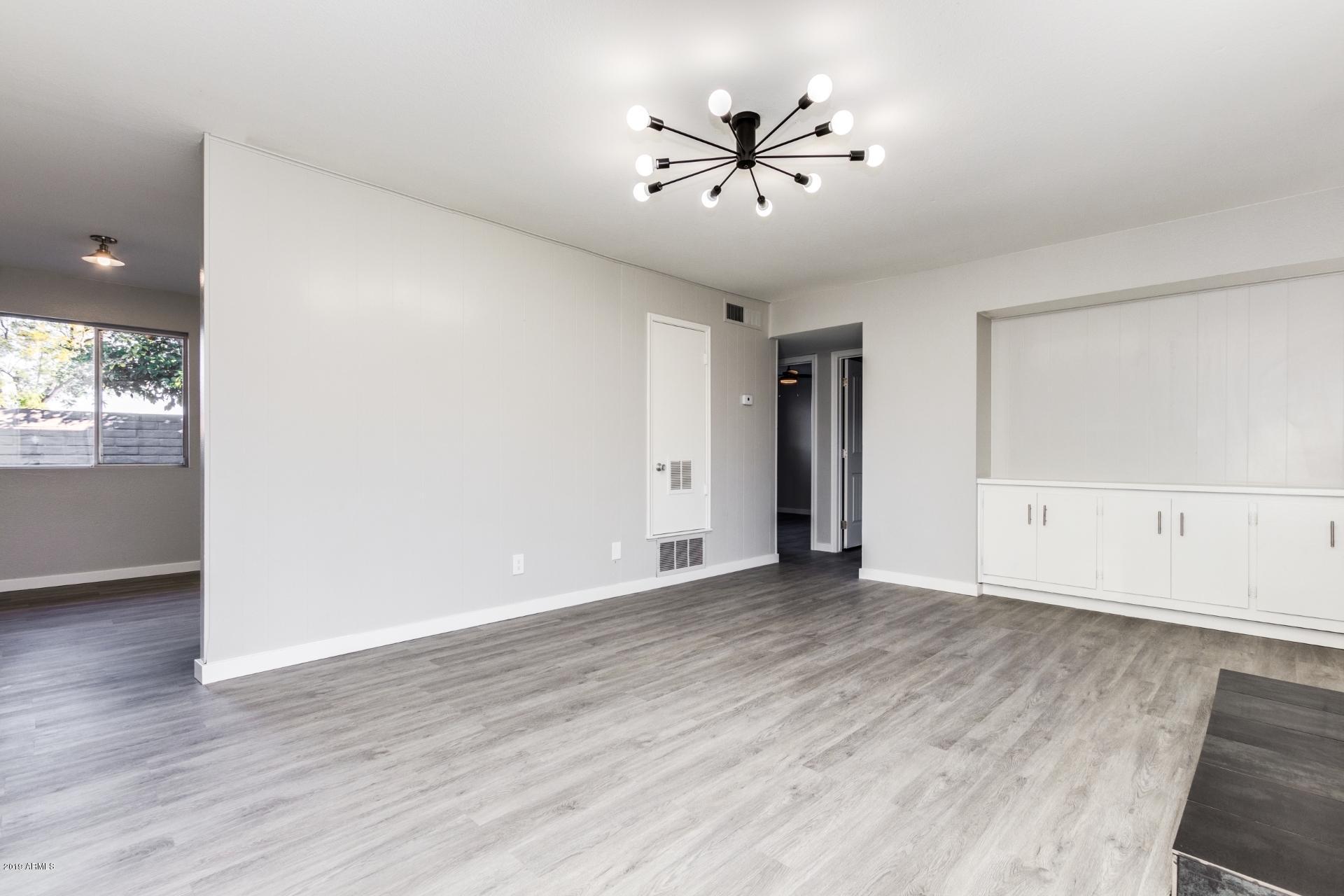 2725 South Rural Road, Unit 2 Tempe, AZ 85282 - Photo 6 of 17 Living room with kitchen on left