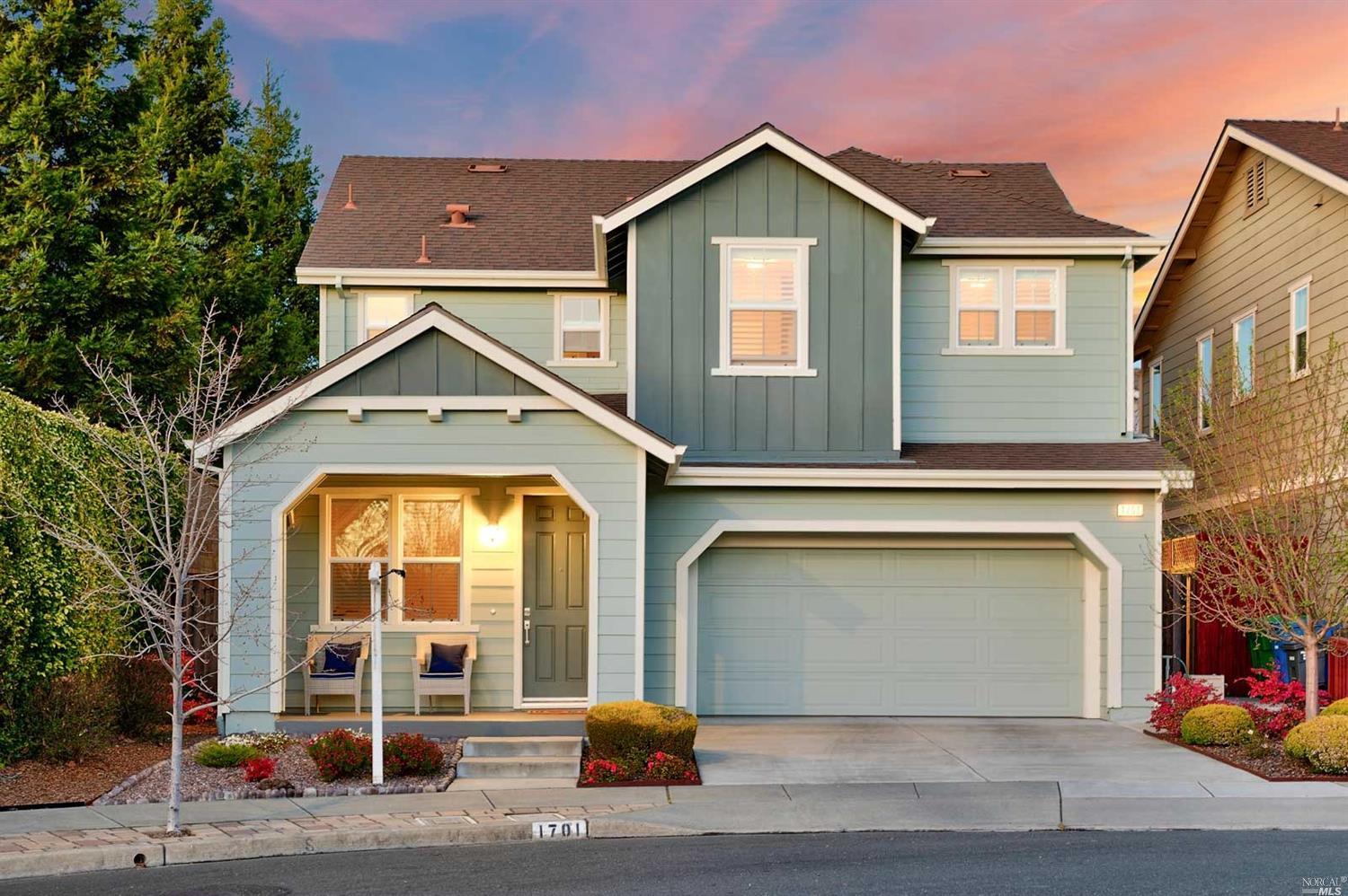 a front view of a house with a garage