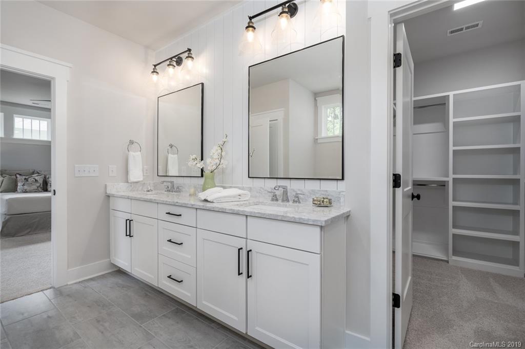 903 Millbrook Road Charlotte, NC 28211 - Photo 22 of 35 a bathroom with a granite countertop sink double and mirror