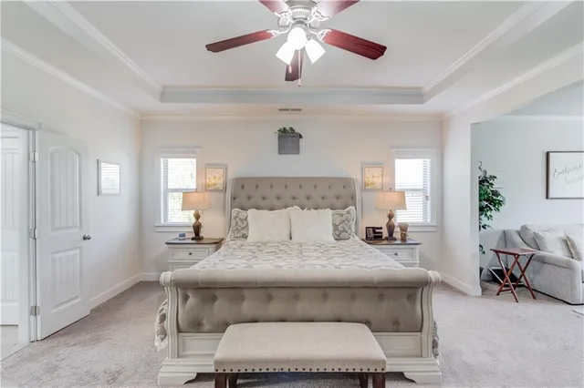 a bed room with a bed and a chandelier