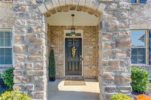 a front view of a house with a outdoor shower