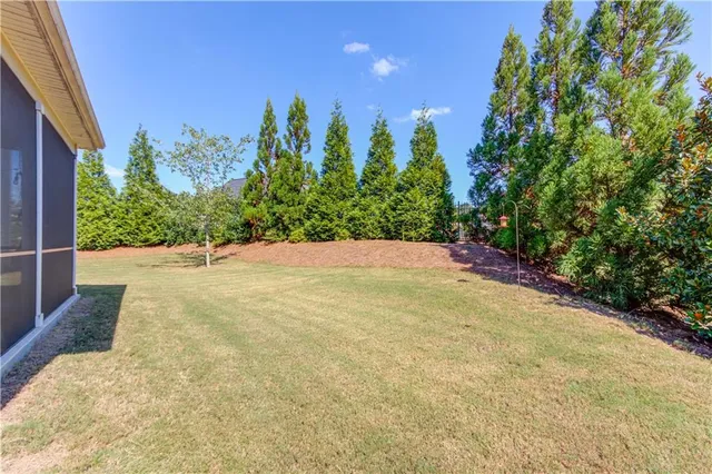 a aerial view of a house with a yard