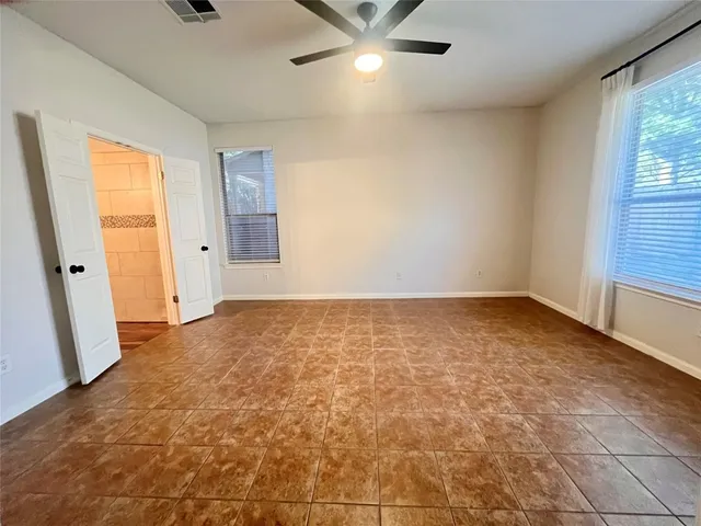 a view of an empty room and window