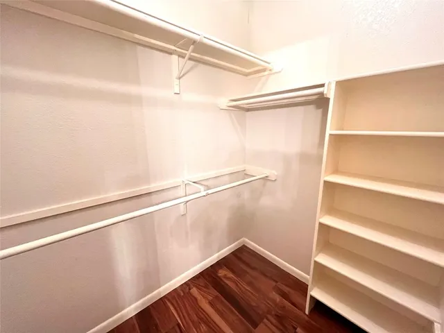 a view of an empty walk in closet