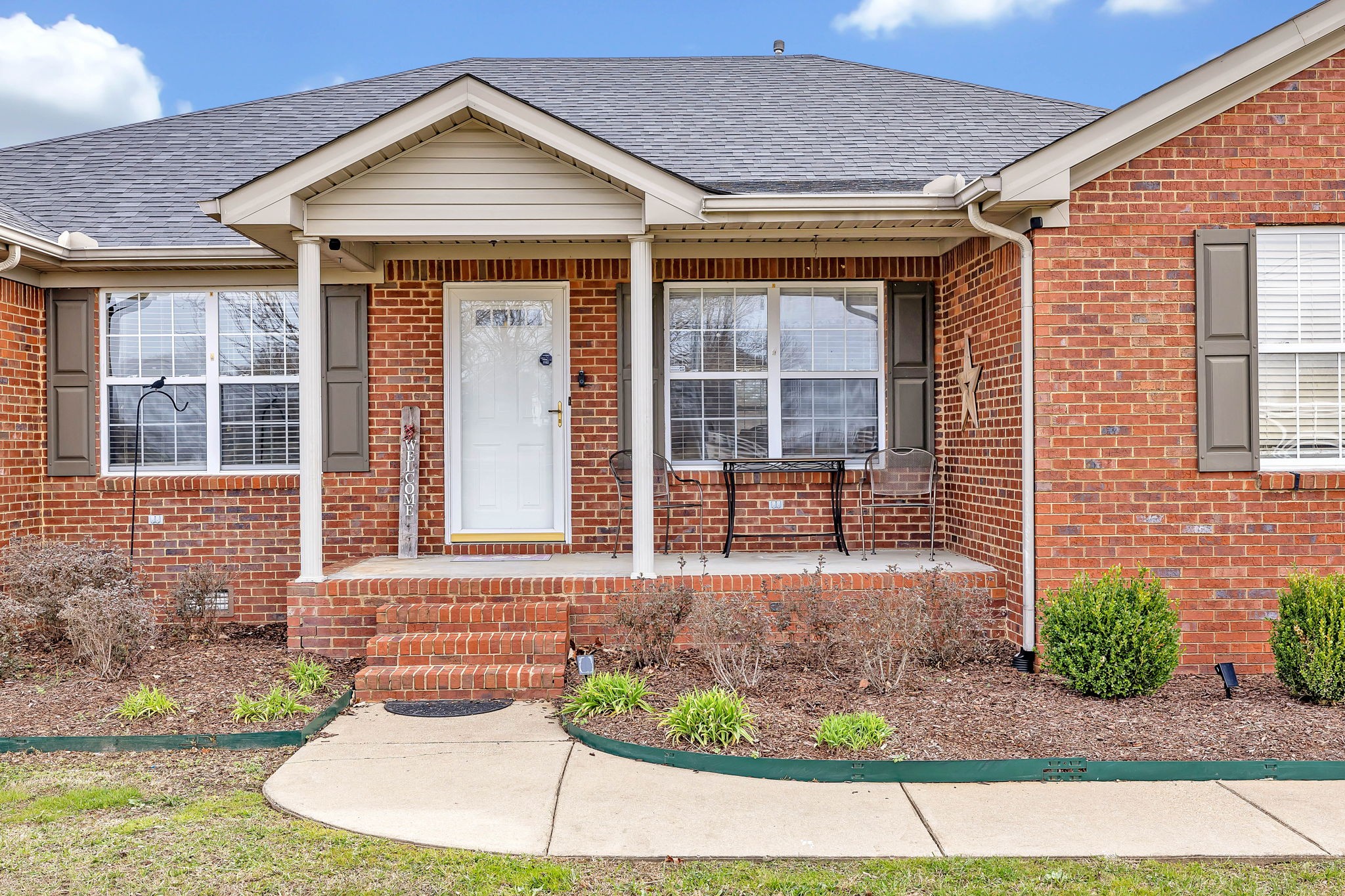 362 Patrick Road Fayetteville, TN 37334 - Photo 5 of 43 a front view of a house with garden