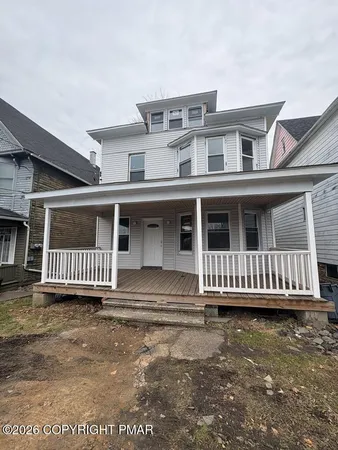 a front view of a house with a balcony