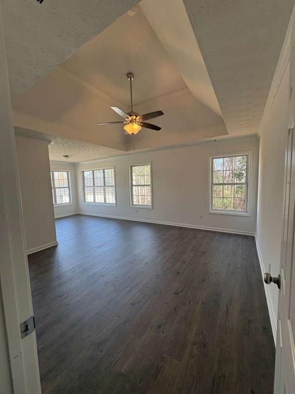 500 Shiver Boulevard Covington, GA 30016 - Photo 12 of 25 an empty room with wooden floor and windows