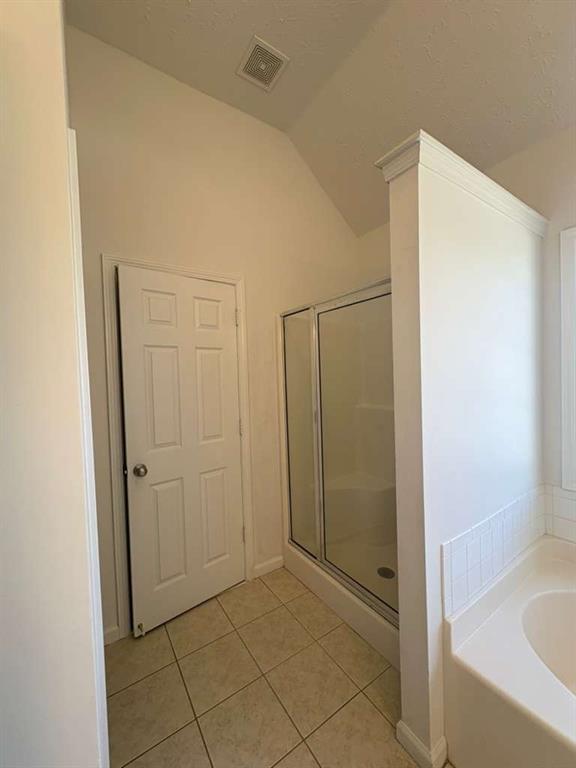 500 Shiver Boulevard Covington, GA 30016 - Photo 14 of 25 a bathroom with a bathtub and shower