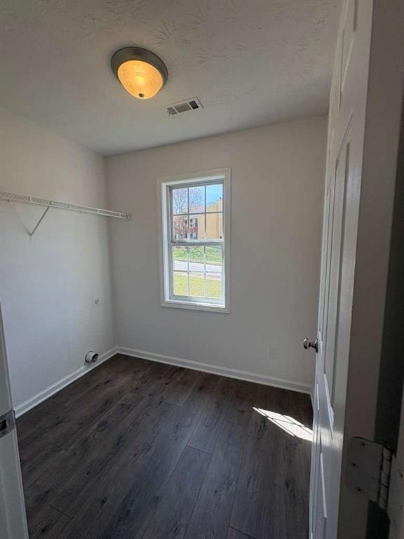 500 Shiver Boulevard Covington, GA 30016 - Photo 16 of 25 a view of an empty room with wooden floor and a window